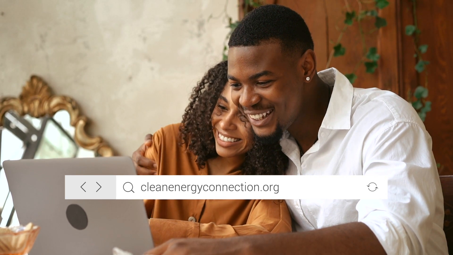 Couple looking at computer screen while searching the Clean Energy Connection